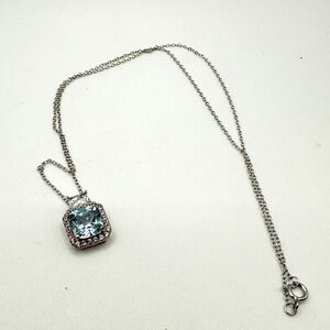 Marked DHJ 925, blue topaz, and CZ accented sterling silver necklace!